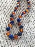 Polished Baltic amber and gemstone teething necklace